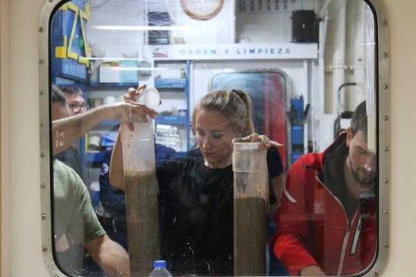 scientists examine seafloor sand